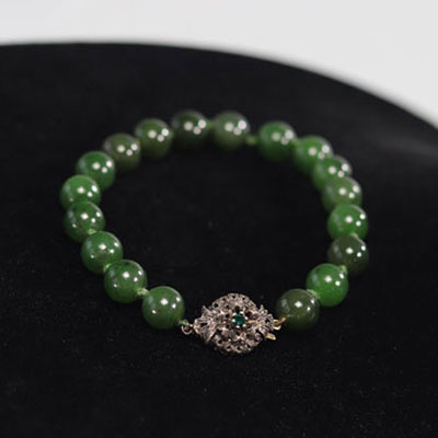 Green jade bracelet with silver setting