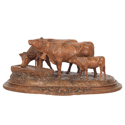 Switzerland, cows at the watering trough in finely carved wood, work from the black forest around 1900