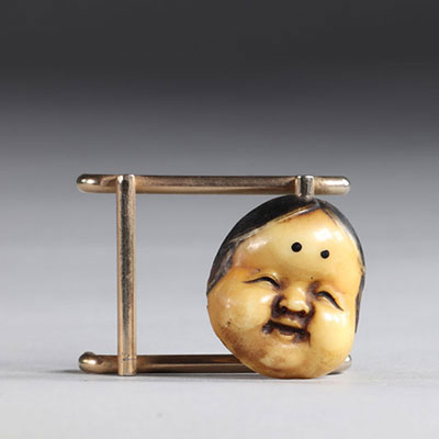 Netsuke carved - a mask. Japan Meiji 19th century