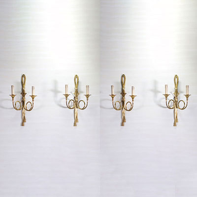 Série de quatre applique en bronze doré formants des nœuds