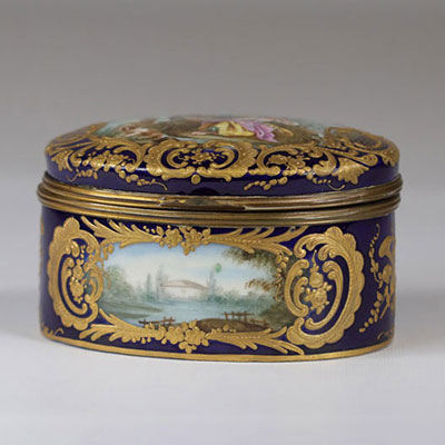 Sevres porcelain covered box painted with romantic scenes