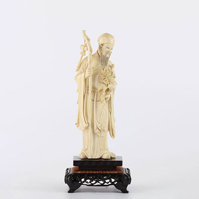 China sculpture of a sage carrying a flower and a stick circa 1900