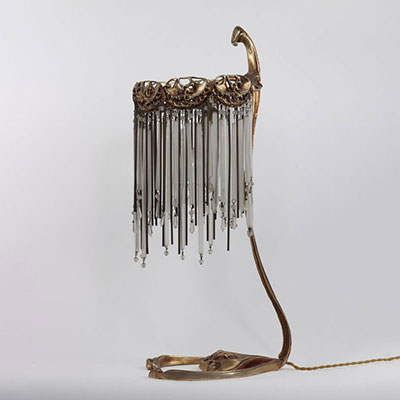HECTOR GUIMARD, 20th century, rare model of a gilded bronze table lamp with an eventful shaft and decorated with openwork elements. Ornamentation and patterns of plants