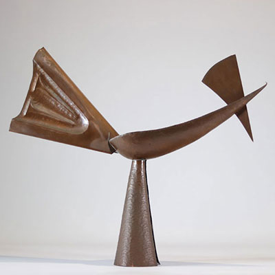 Abstract sculpture of a bird in copper