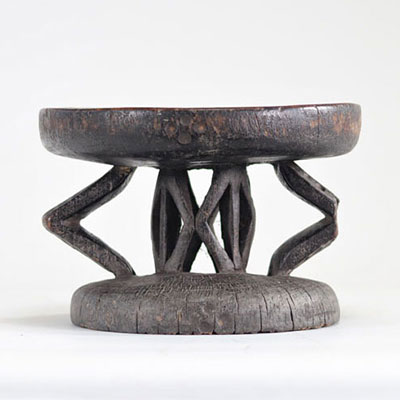 Wooden stool with dark patina originating from Africa