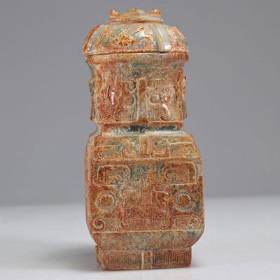 Covered vase in carved stone archaic decor