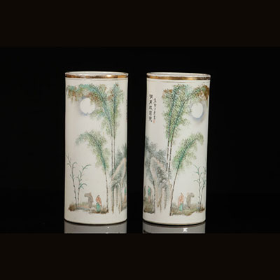 China - pair of hat racks in Qianjiang enamel porcelain with character decoration, mark in red at the base and artist signature