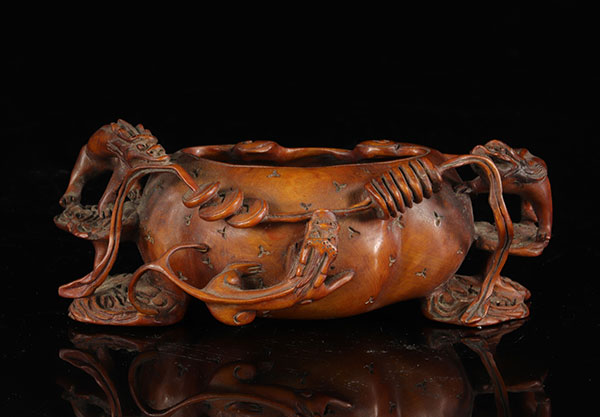 Carved wooden brush rinser decorated with dragons. Twentieth century.