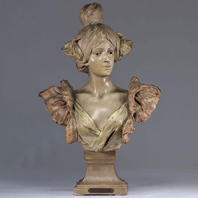 Art Nouveau bust of a young woman in patinated terracotta