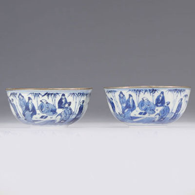 Pair of blue white bowls decorated with characters