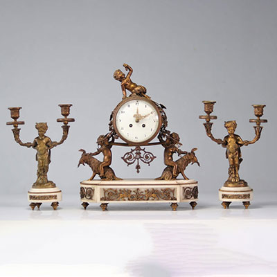 Pendulum set and Louis XVI bronze candlesticks decorated with fauns