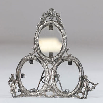 Silver frame decorated with musical characters