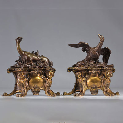 (2) Pair of Louis XV-style bronze andirons with double patina, decorated with dragons and angels' heads