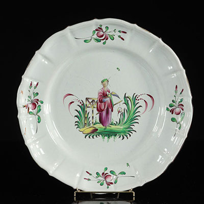 Les Islettes France Large rare circular dish decorated with a female character dressed in Chinese style. 18th