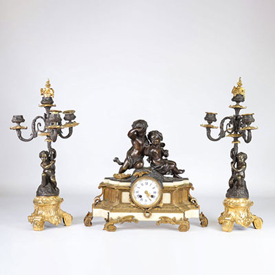 Pendulum cherub and bronze candelabra garniture with two patinas