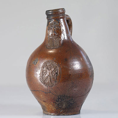 Raeren stoneware jug decorated with a bearded man 16th
