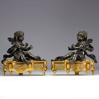 (2) Pair of Louis XV-style bronze andirons with brown patina and putti decoration on a gilded bronze base decorated with foliage and foliage on 19th-century turret feet