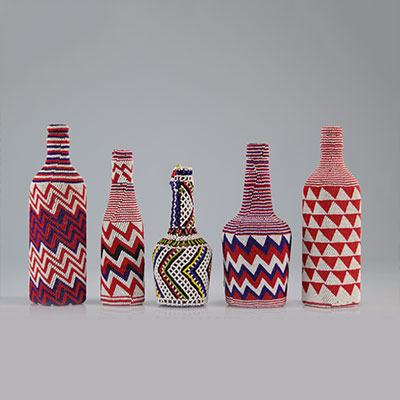 Set of beaded bottles with geometric patterns