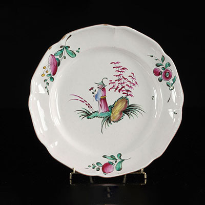 Les Islettes France Plate with standing Chinese holding a red flower. 18th