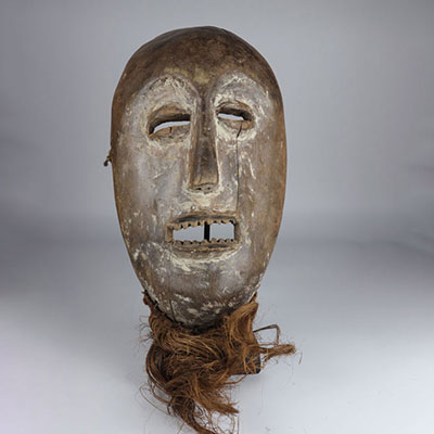 Africa Léga mask in carved wood and fiber 20th