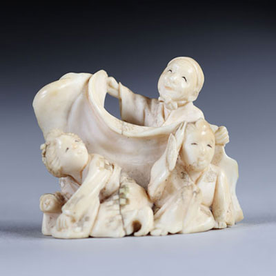 Netsuke carved from a group - figures. Japan Meiji period around 1900