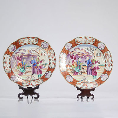 Pair of porcelain plates with Chinese plate holders