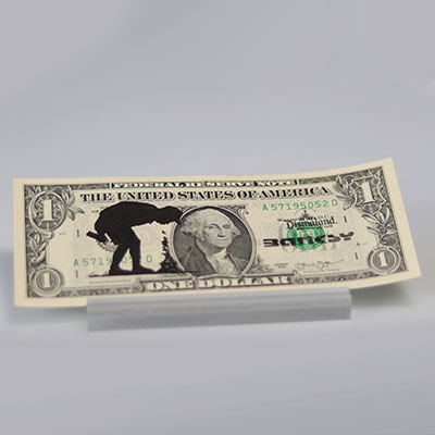 BANKSY (born in 1974), in the style of Dismal dollar Stamps on genuine one dollar bill Signature stamp and stamp of Dismaland on the right