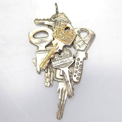 Arman Fernández. Accumulation of keys. Silver and gold metal pendant. Signed 