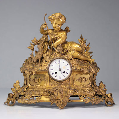 Louis XV clock in gilded bronze surmounted by a young archè
