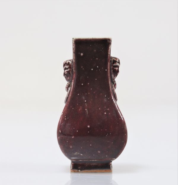 Oxblood Vase Decorated With Qing Period Heads