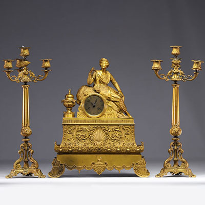 Gilt bronze clock and candelabra with Orientalist subjects, early 19th century.