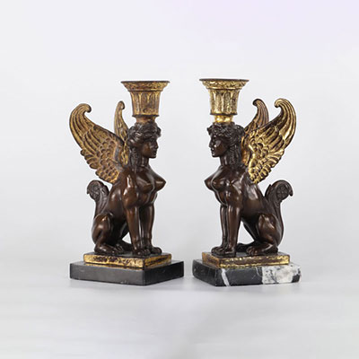 Pair of empire candlesticks with sphinxes in bronze with double patina