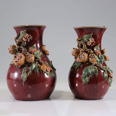 Pair of glazed stoneware vases in relief 
