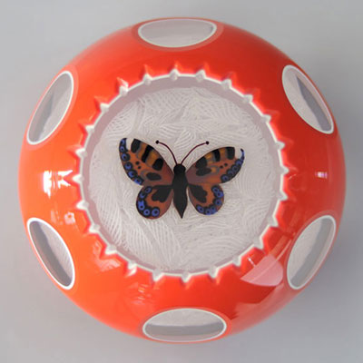John Deacons 2005 paperweight, orange and white double overlay with butterfly on muslin background