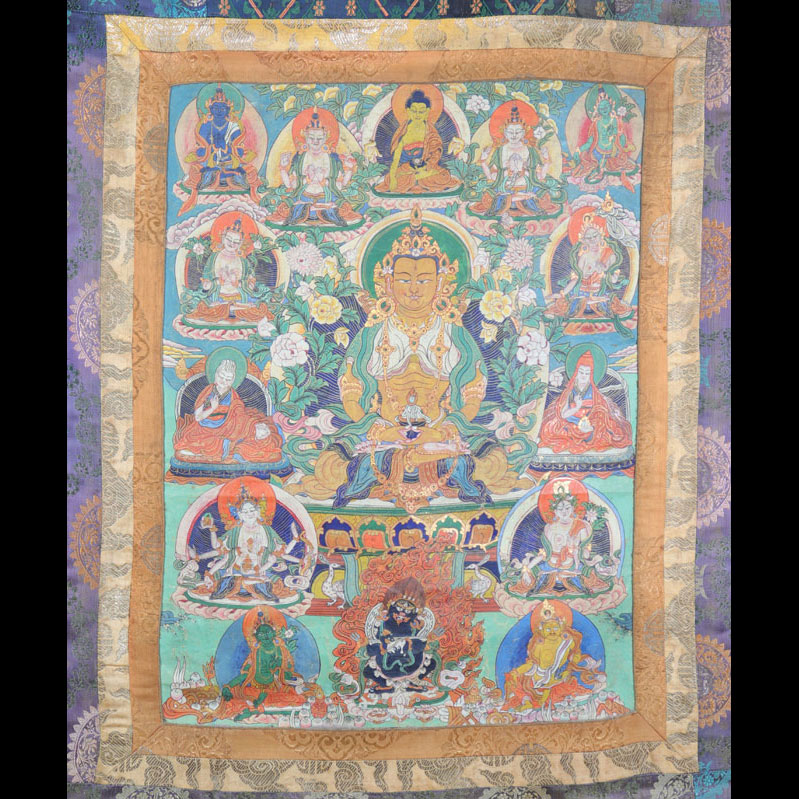 Tanka framed in golden silk with various deities, Tibet, 18th century