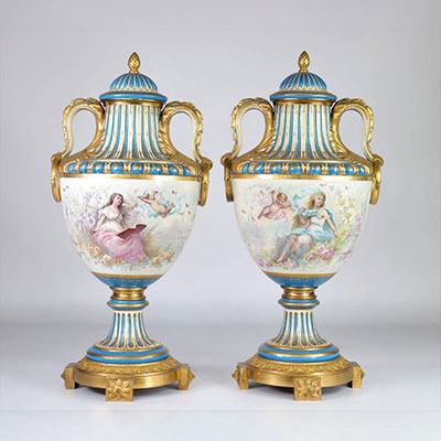 Sèvres pair of monumental vases mounted on gilded bronze, painted with romantic scenes, the reverse of a cupid