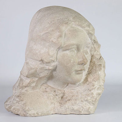 Head of a young woman 1900 in stone carved in French stone