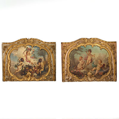 Very important pair of architectural elements in gilded wood decorated with oil on canvas in the Putti style, 18th century.