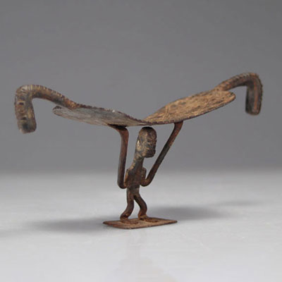 Rare Dogon iron neckrest decorated with a character
