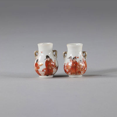 Pair of iron red porcelain vases with character decoration, Republic period China.