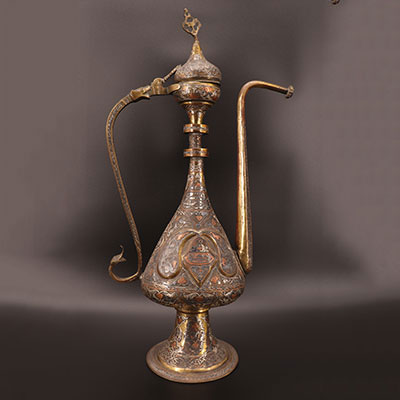 Ottoman - Large ewer in finely chiseled brass and inlaid with silver 19th