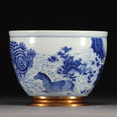 China - A white-blue porcelain vase decorated with elephant, horse and rabbit, Qing period.