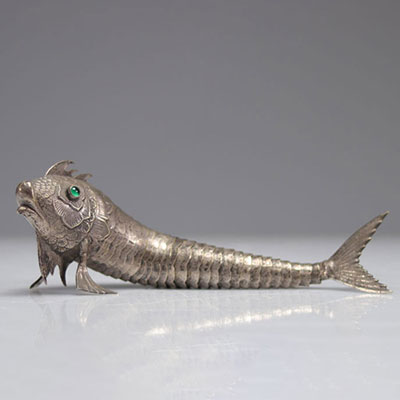 Articulated silver metal fish with stone-encrusted eyes
