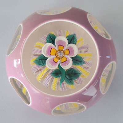 John Deacons 2009 paperweight, white and mauve double overlay, flower on stem with 7 leaves, yellow and mauve cushion
