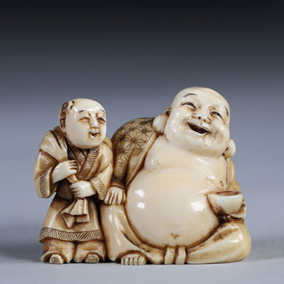 Netsuke sculpté de bouddha et un enfant. Japon époque Meiji vers 1900 signature