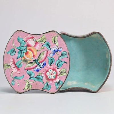 China enamel box decorated with flowers on a pink background
