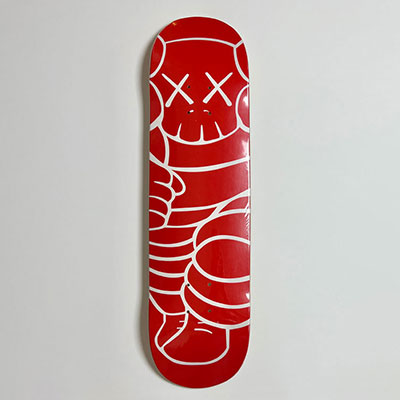 Kaws and Supreme. Schum. Red and white screen-printed skateboard. Supreme publisher in 2001.