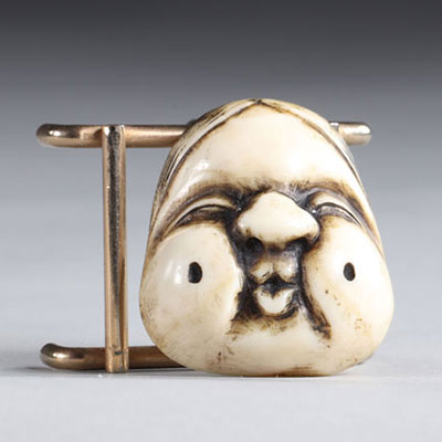 Netsuke carved - a cartoonish mask. Japan Meiji 19th century
