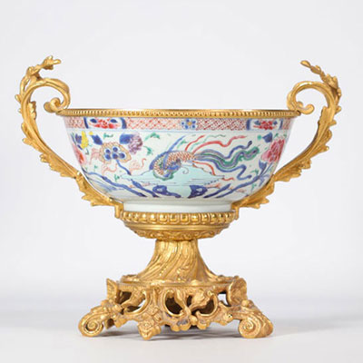 Large famille rose porcelain bowl decorated with a phoenix with an  ormolu mount from 18th century