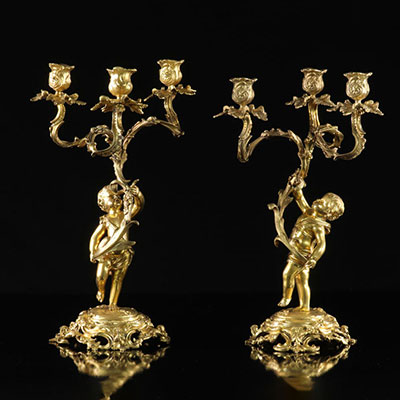 France pair of gilt bronze candelabra decorated with young boys in the 19th Louis XV style